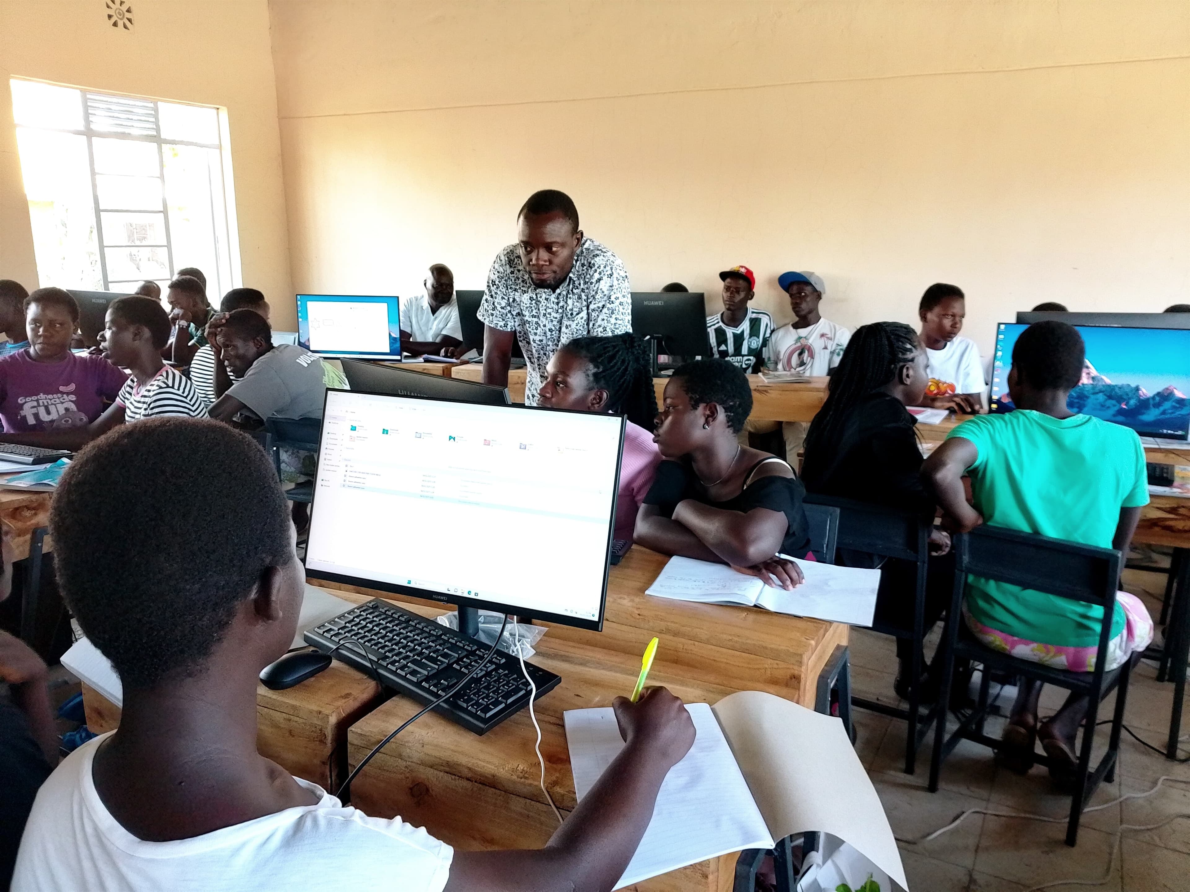 Students learning computer skills in rural Kenya