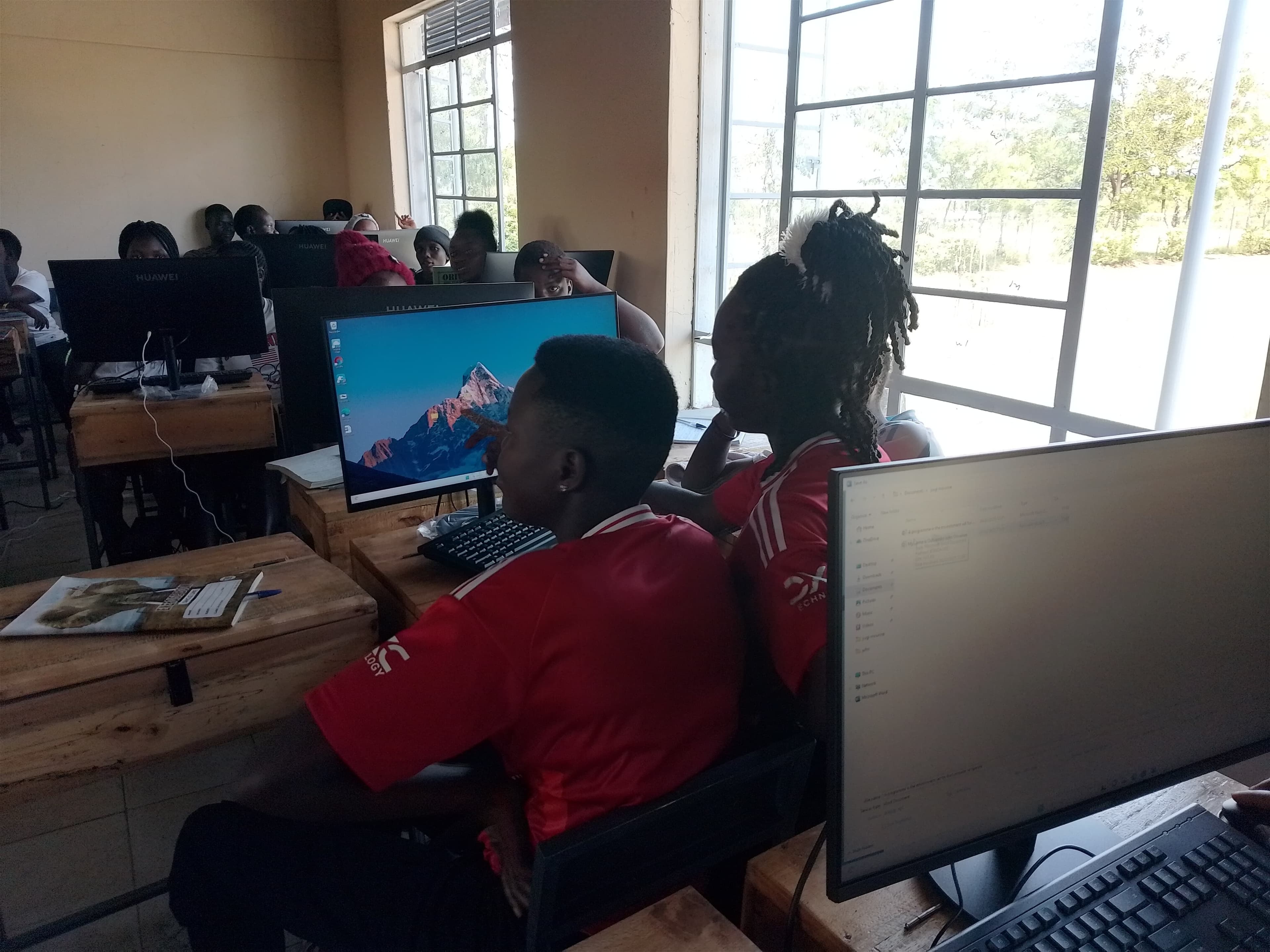 Young women gaining digital literacy skills